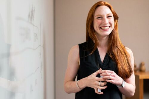 Woman Next To White Board